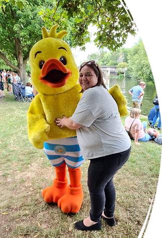 A photo of me hugging a rubber duck.