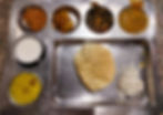 Andhra bhawan veg thali contains a papad, curd , sewaiya, began chana, daal, jeera rice, lal tamator ki sabzi