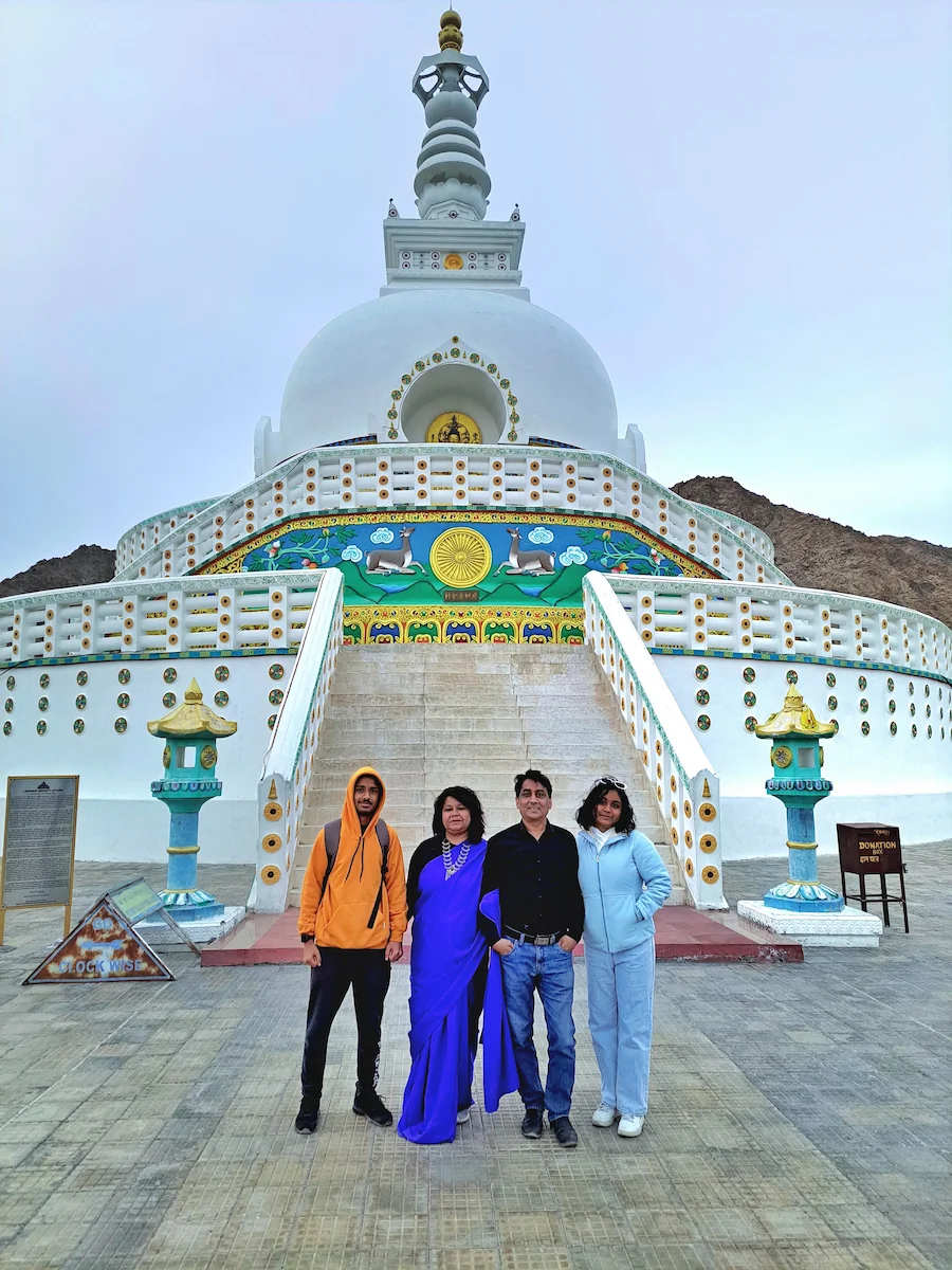 Shant Stupa, Leh - A serene white-domed Buddhist stupa set against a backdrop of rugged mountains and clear blue sky