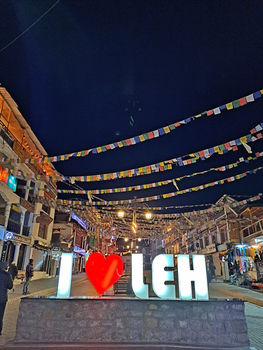 image of leh market at night tibettan flags hung