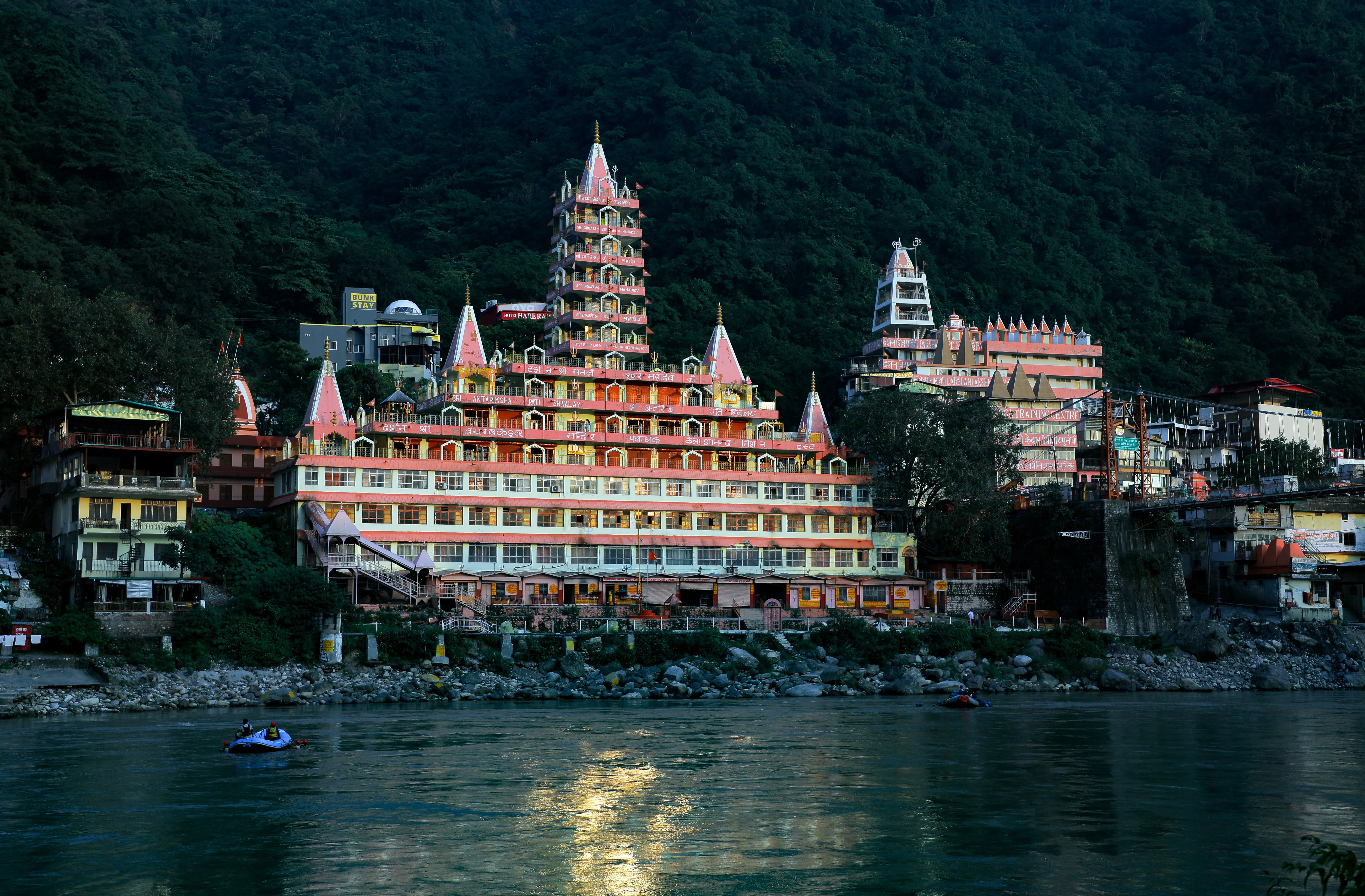 A Shiva temple on the bank on ganga river covered with lush green mounta