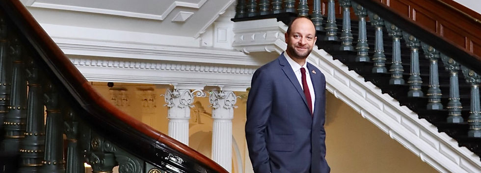 Sam Hooper, attorney, legislative consultant, and lobbyist, photographed on the staircase inside the Texas State Capitol