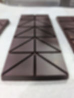 Three dark chocolate bars on white surface; 80% Dark Chocolate Last Resort Chocolate