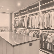 Luxurious walk-in closet with island and