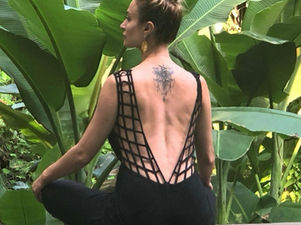 Woman meditating in the jungle in Bali, embodying stillness and self-connection.