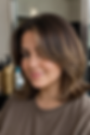 Feathered layered lob with soft brunette balayage for a slimming effect.
