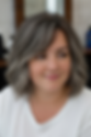Textured layered bob with curtain bangs that slims a round face.