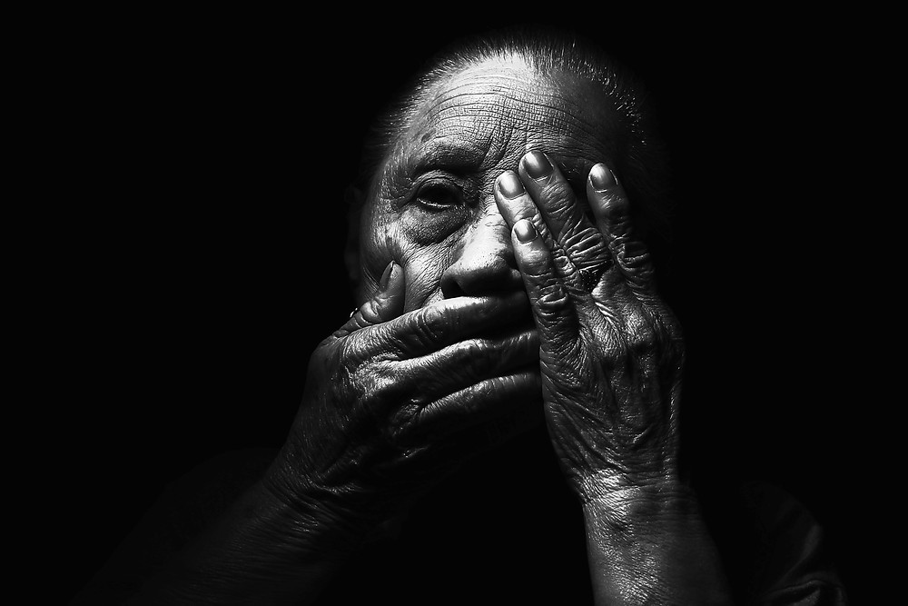 Older woman in the dark