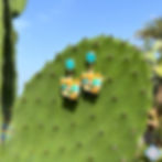 Orecchini a vite con cristallo azzurro e Trinacria pendente