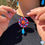 Thumbnail: Parure con ruote di carretto siciliano rosse e gocce di ceramica