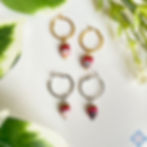 Orecchini a cerchio con teste di moro magenta