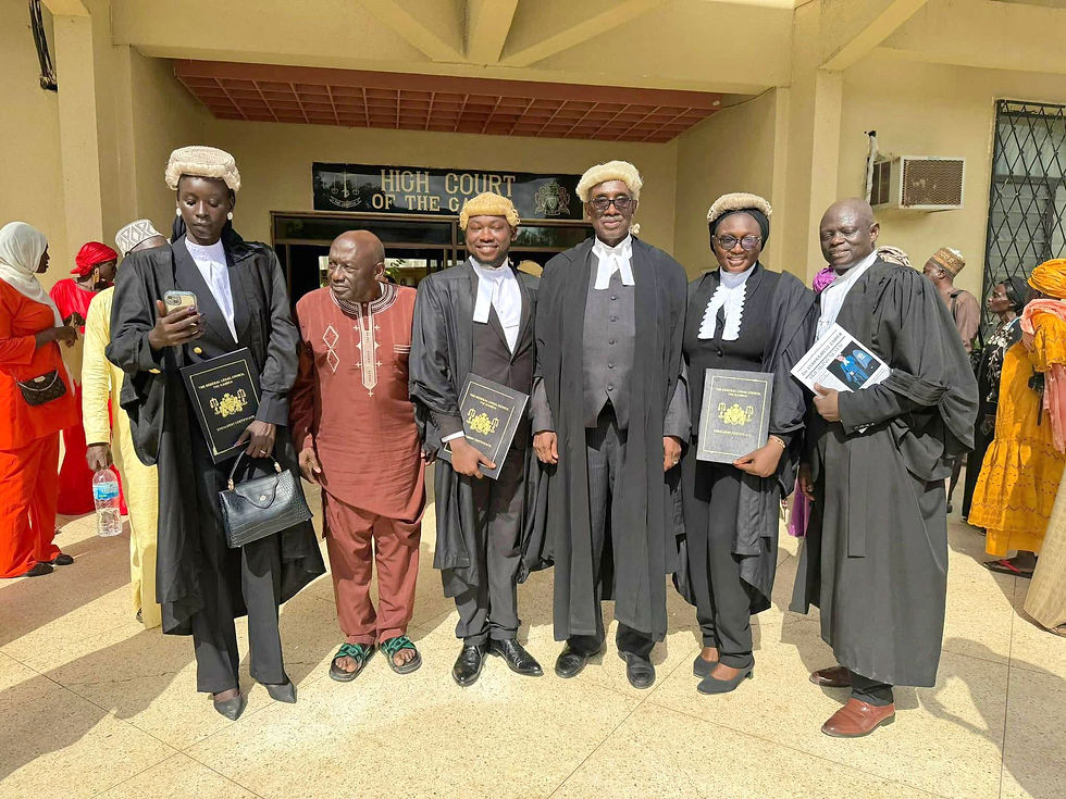 Lawyer Fakebba John Darboe flanked by his father, Chief Justice, Barrister Lamin J Darbo and other enrolled Barristers