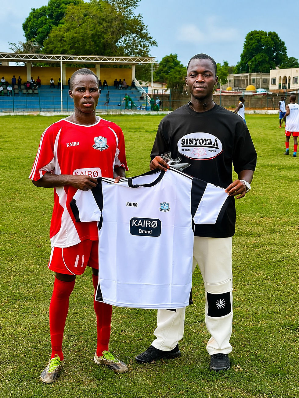 Abubacarr Darboe (Right) returned from a “Backway” journey to start a thriving clothing business in Gunjur 