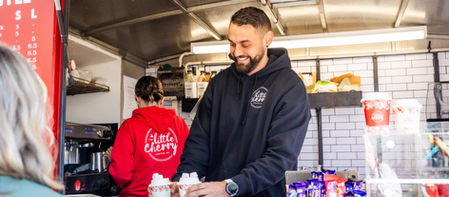 serving coffees to customers
