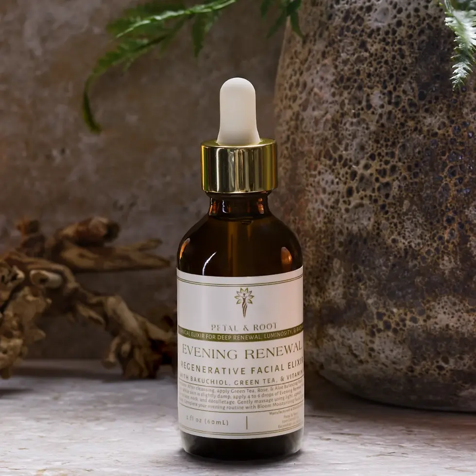 2 oz amber glass bottle of Evening Renewal on a stone surface, surrounded by a soft spa atmosphere with blurred background