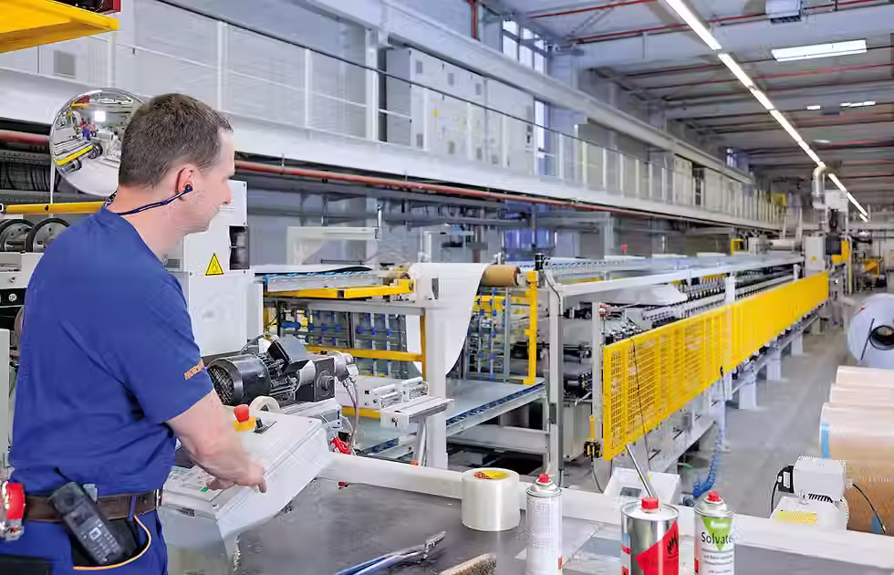 an employee at Hormann in Germany manufacturing garage doors 
