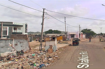 trash along the sides of the road in Bhuj