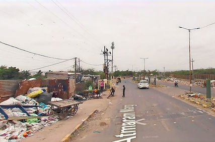 trash along the sides of the road in Bhuj