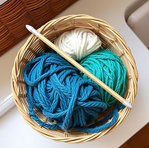 yarn in a basket with a crochet hook.jpg