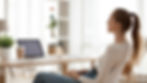 Calm peaceful young woman relaxing in office chair at workplace, tired employee sitting at