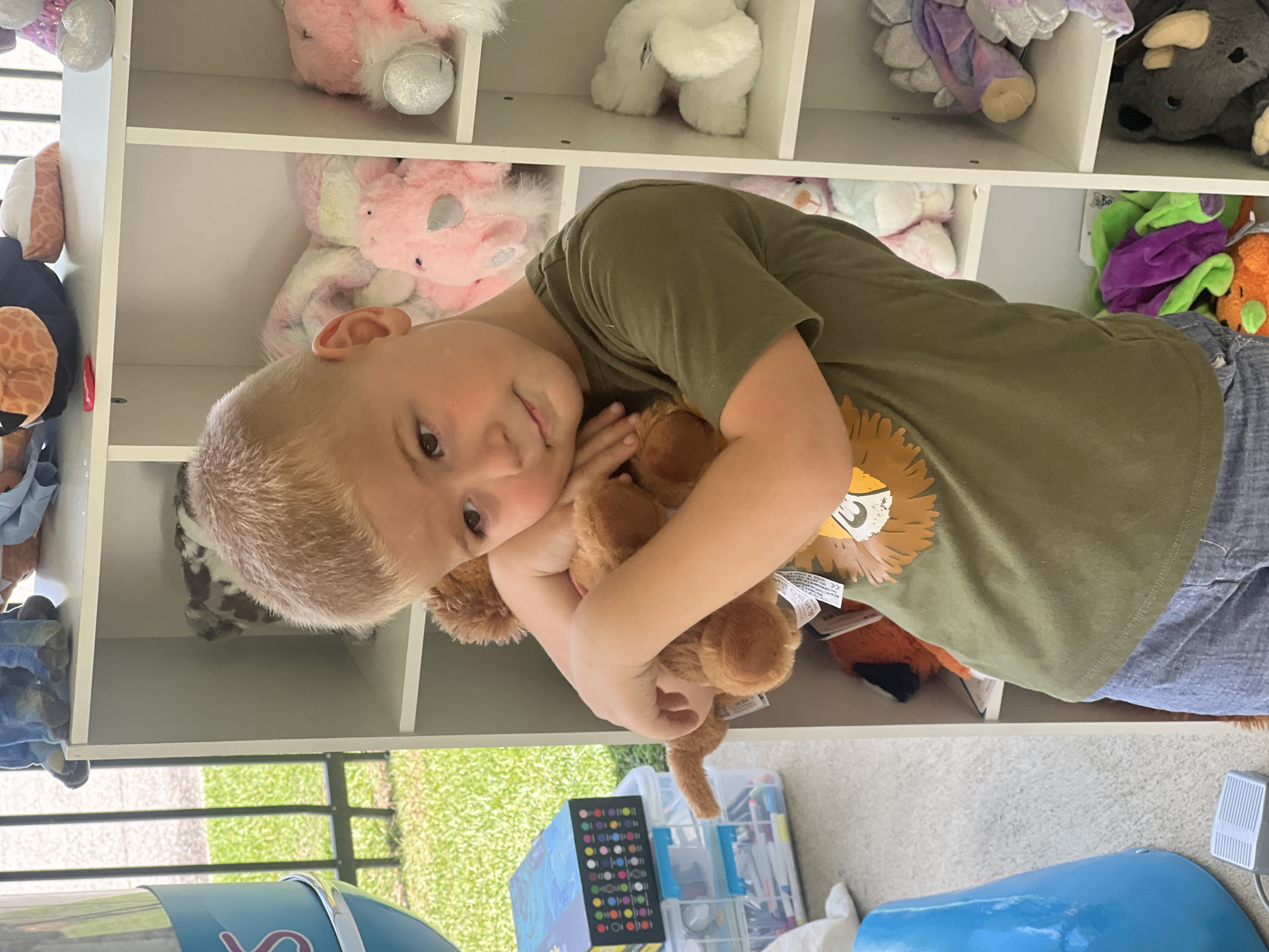 Girl hugging her new Beary Fun Friends stuffed animal