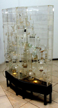 Mixed media: Laboratory glass, handblown glass, Perspex, metal and electric fitting. 157.5 x 107 x 30 cm. South African Military Health Services (SAMHS) Art Collection