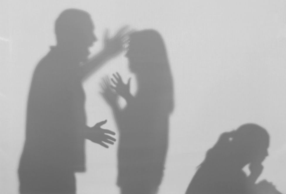 Silhouettes of quarreling parents and little child on white background. Domestic violence