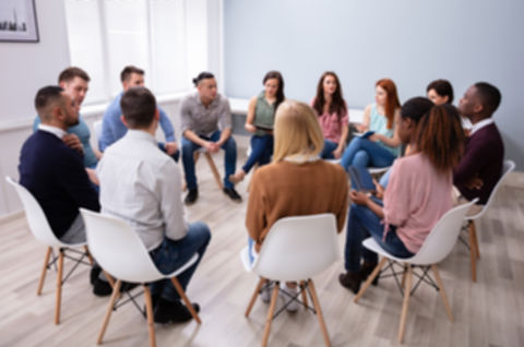 Young Multiracial Millennial Friends Sitting In Circle Having Group Discussion_edited.jpg