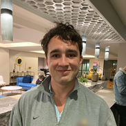 Man smiling in a lounge