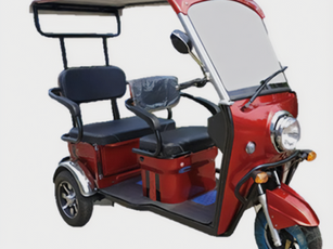 Red electric trike with roof.