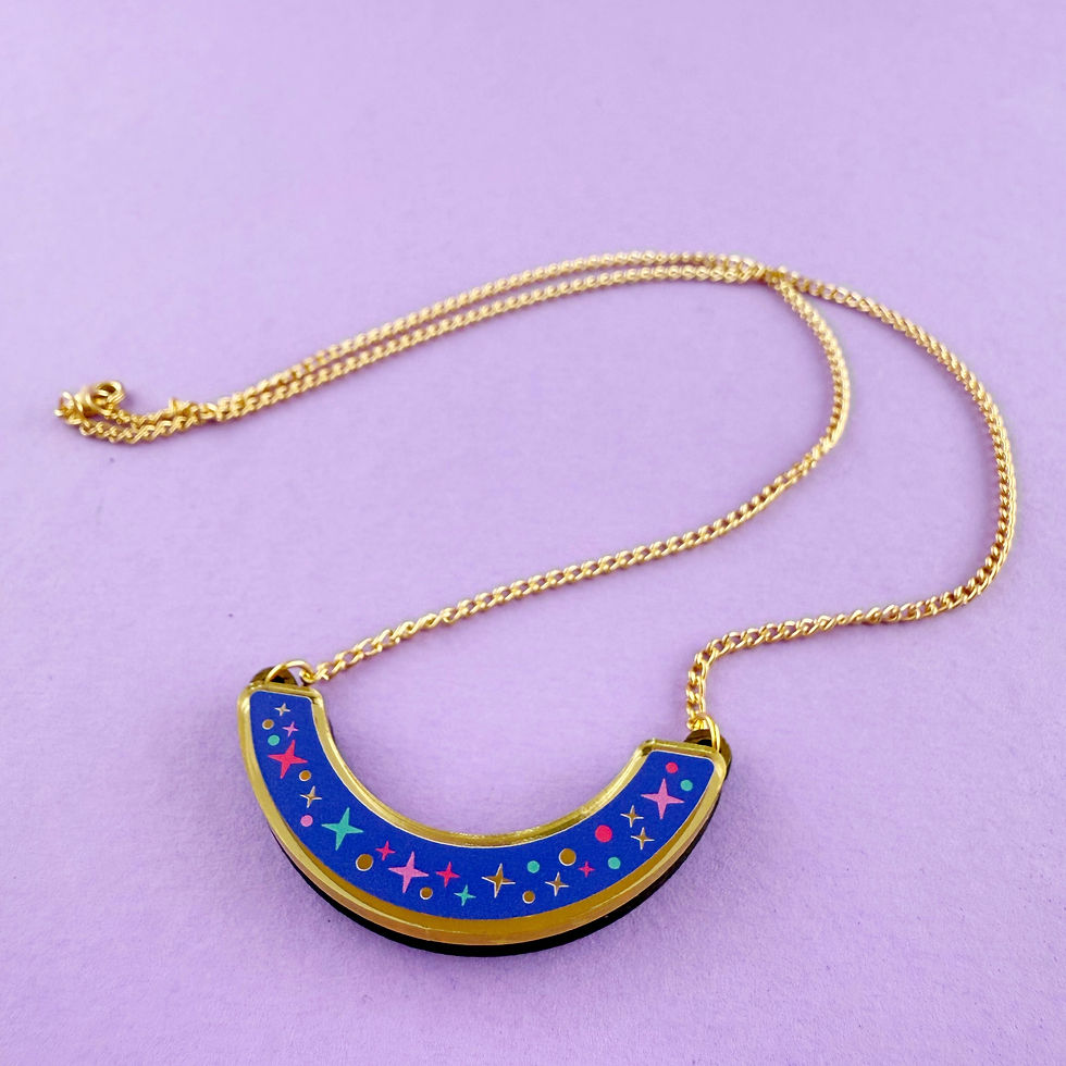 Thumbnail: Blue acrylic night sky necklace featuring colourful stars on mirrored gold acrylic