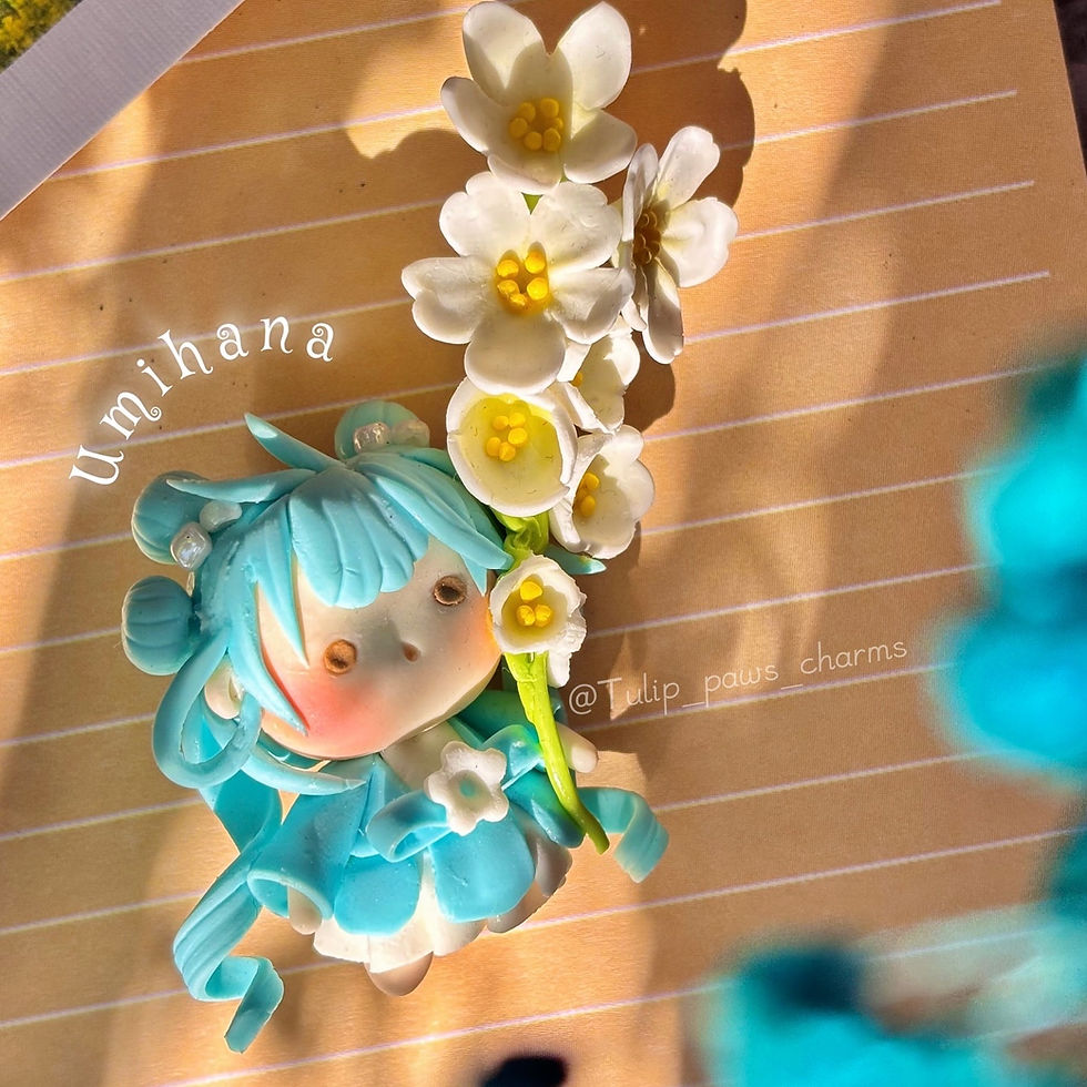 umihana ocean fairy keychain handmade clay pixie with blue hair and white flowers - Desk Top View