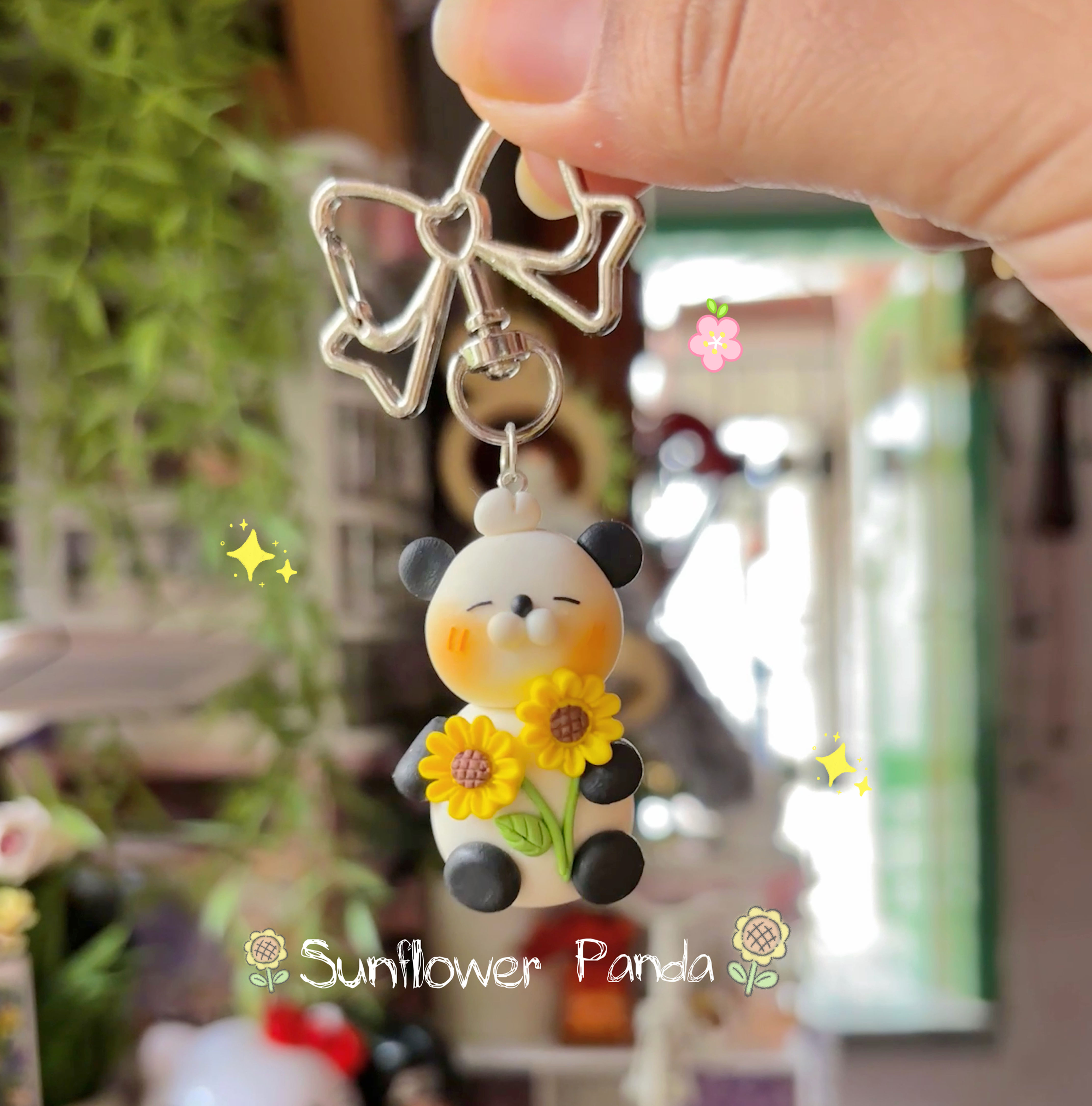 sunflower panda keychain cute clay panda holding yellow flowers - Front View