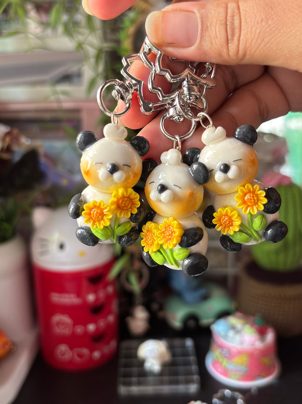Thumbnail: sunflower panda keychain cute clay panda holding yellow flowers - Group View