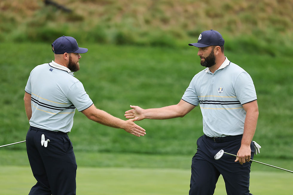 Jon Rahm high fives Tyrrell Hatton of Team Europe after his putt on the eighth hole during the 2025 Ryder Cup on the Black Course at Bethpage State Park on Friday, September 26, 2025 in Farmingdale, New York. (Photo by Michael Reaves/PGA of America)