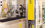 Cartoning machine packaging products in FMCG production environment