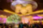 Luxury Indian wedding reception at Renaissance Schaumburg Convention Center Chicago with grand ballroom lighting and décor