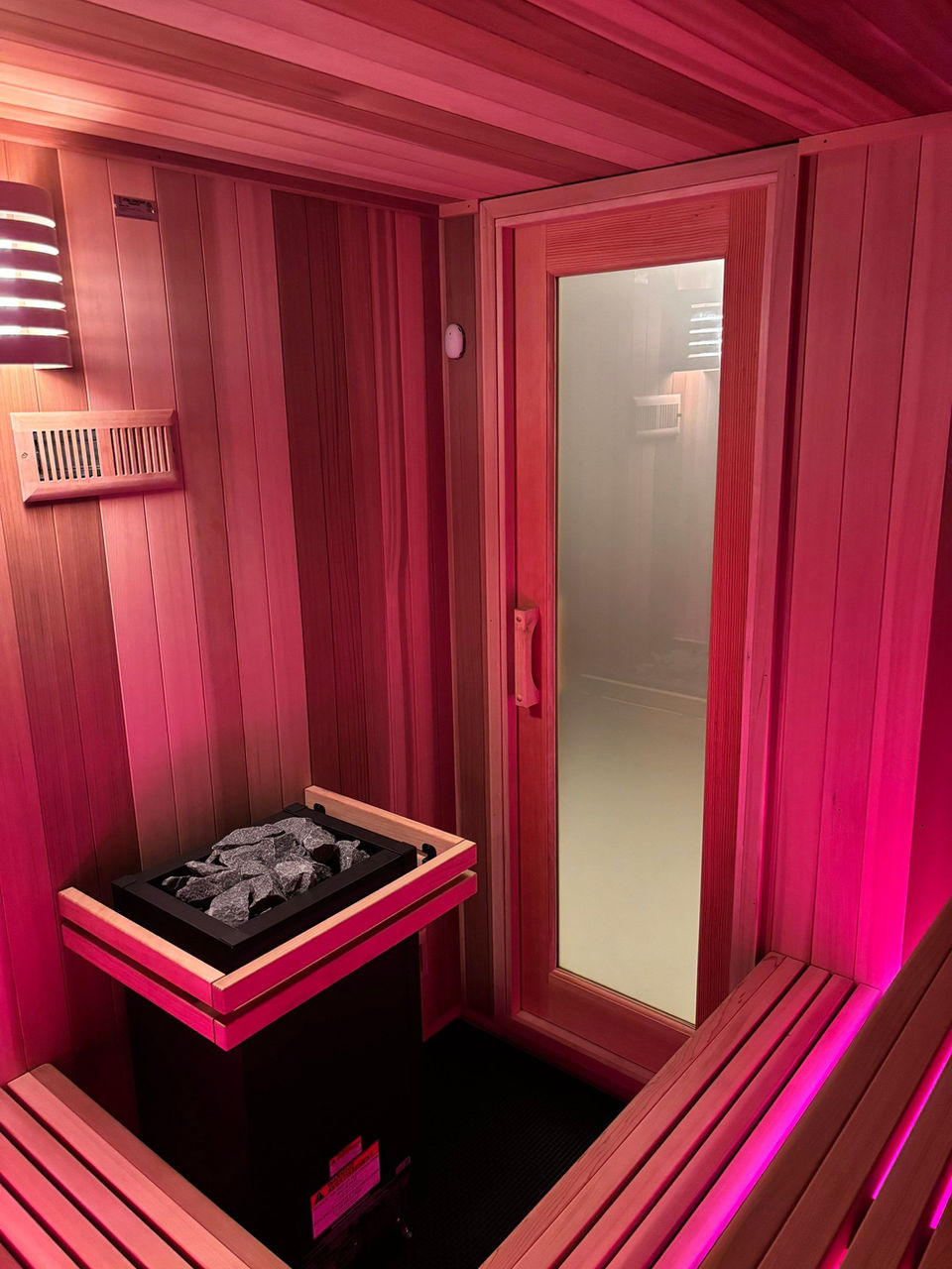 Virta Electric Sauna Heater in a custom Sauna with custom lighting options.