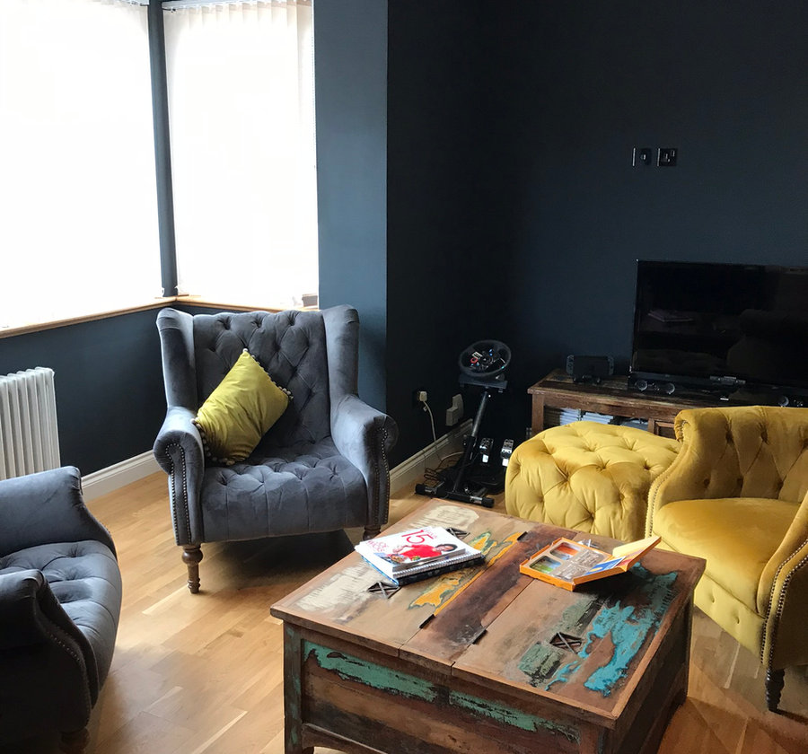 Living room with deep teal walls
