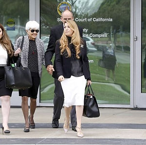 Tamar walking with clients after winning court case