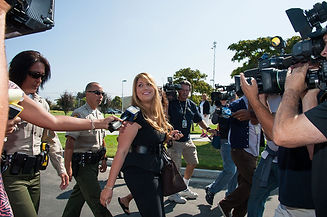 Tamar followed by reporters