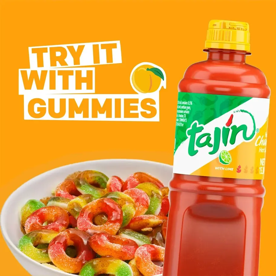 Bottle of Tajin Fruity Chamoy Hot Sauce, 15.38 Fl Oz with sweet and tangy flavors.