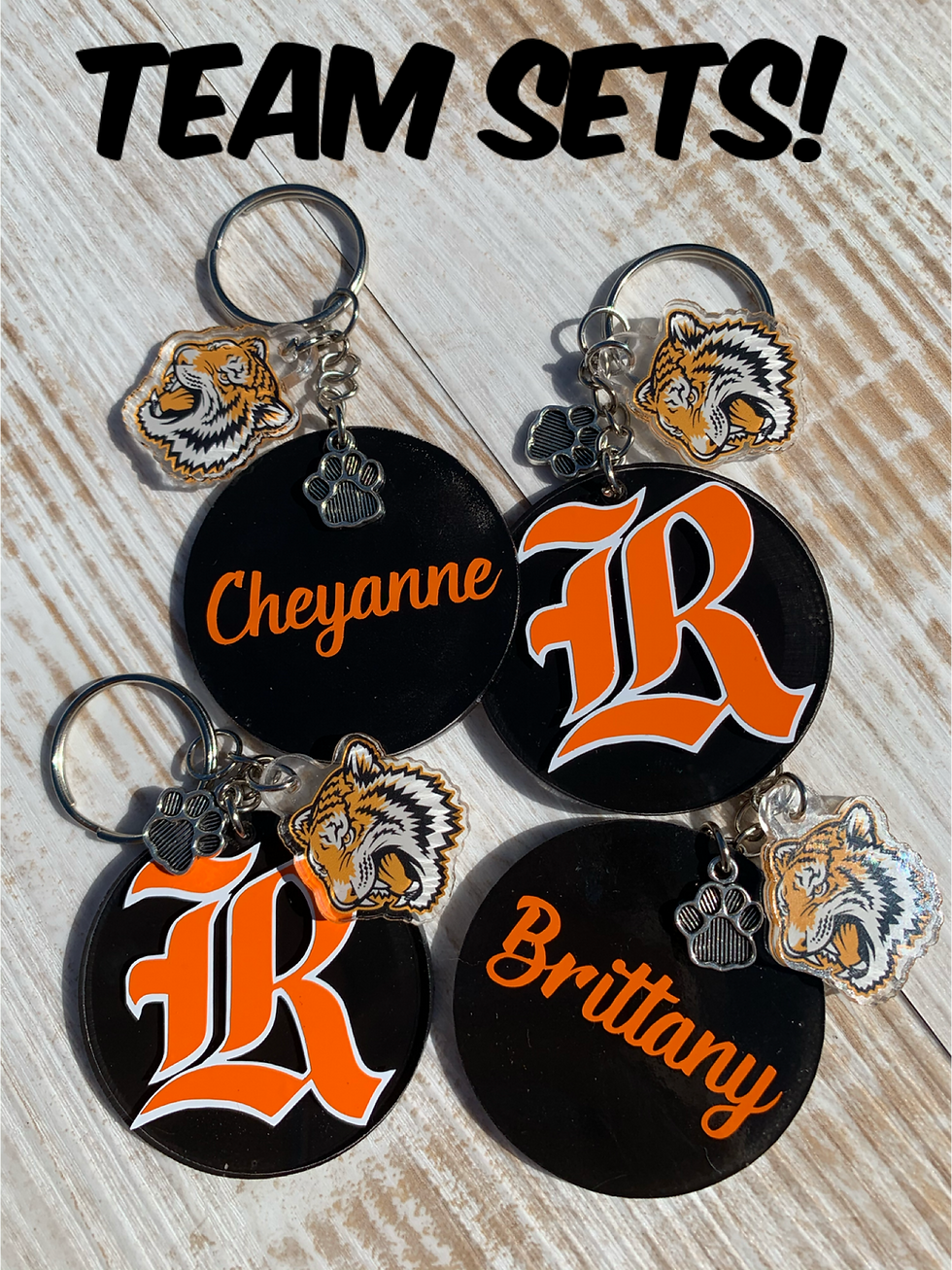 Thumbnail: Team keychains and bag tags.