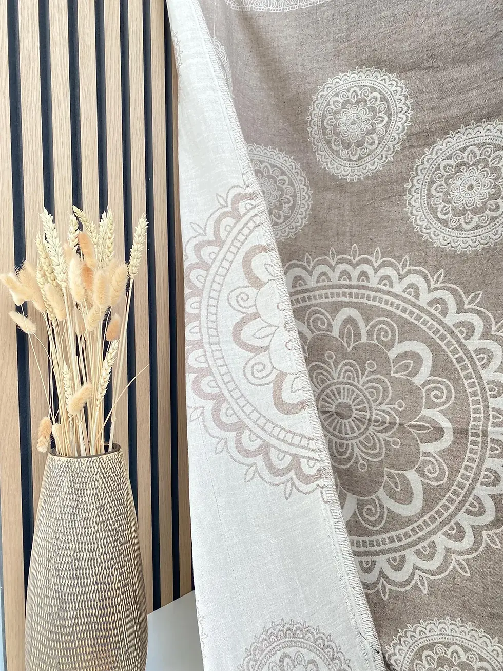 Thumbnail: Decorative mandala design Zeugma Turkish Towel with vase of dried flowers and striped wall.