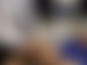 Clinician performing hamstring ultrasound to assess muscle injury recovery.