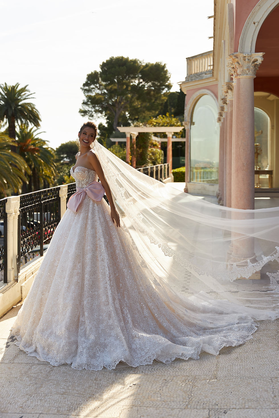 Close-up view of a delicate lace wedding dress on a mannequin