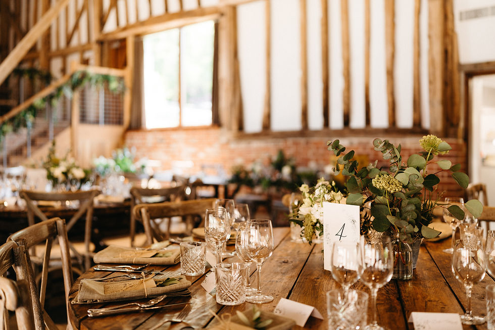 table display in a barn on a wedding day