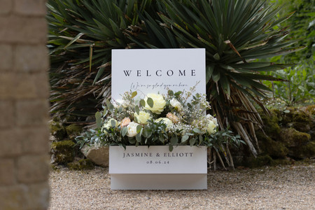 photo of welcome sign with flower display