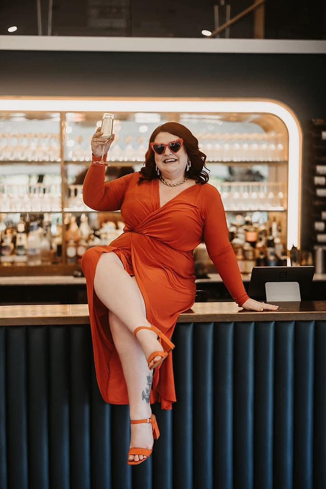 georgina the celebrant holding a glass of Champagne 