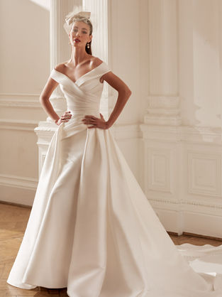 Mikado satin fishtail wedding dress with falttering ruching and over skirt.